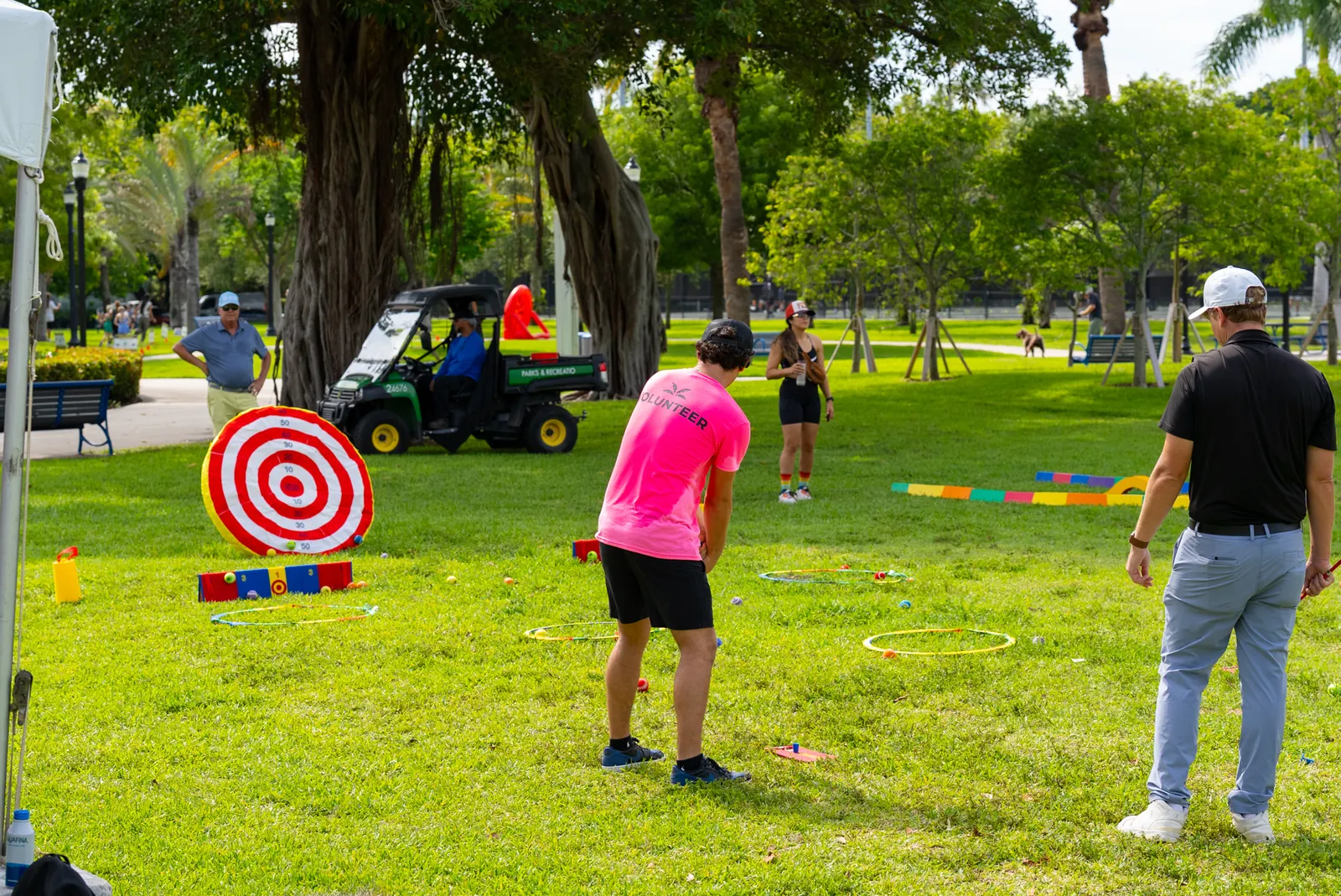 Outdoor open-play activities with colorful targets and families