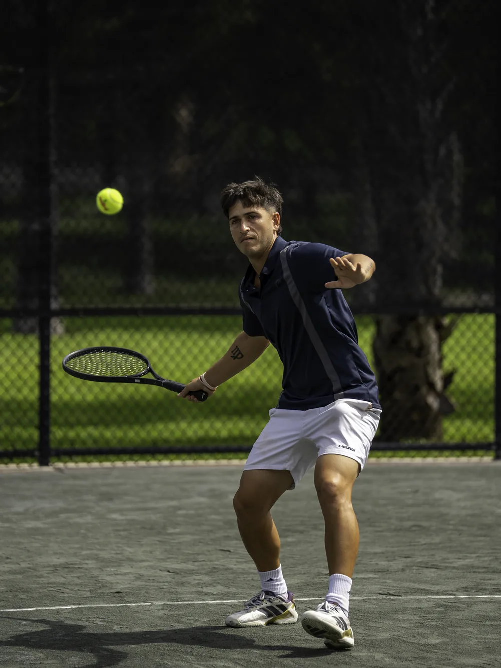 Tennis player preparing a forehand shot at the 2026 festival tennis courts