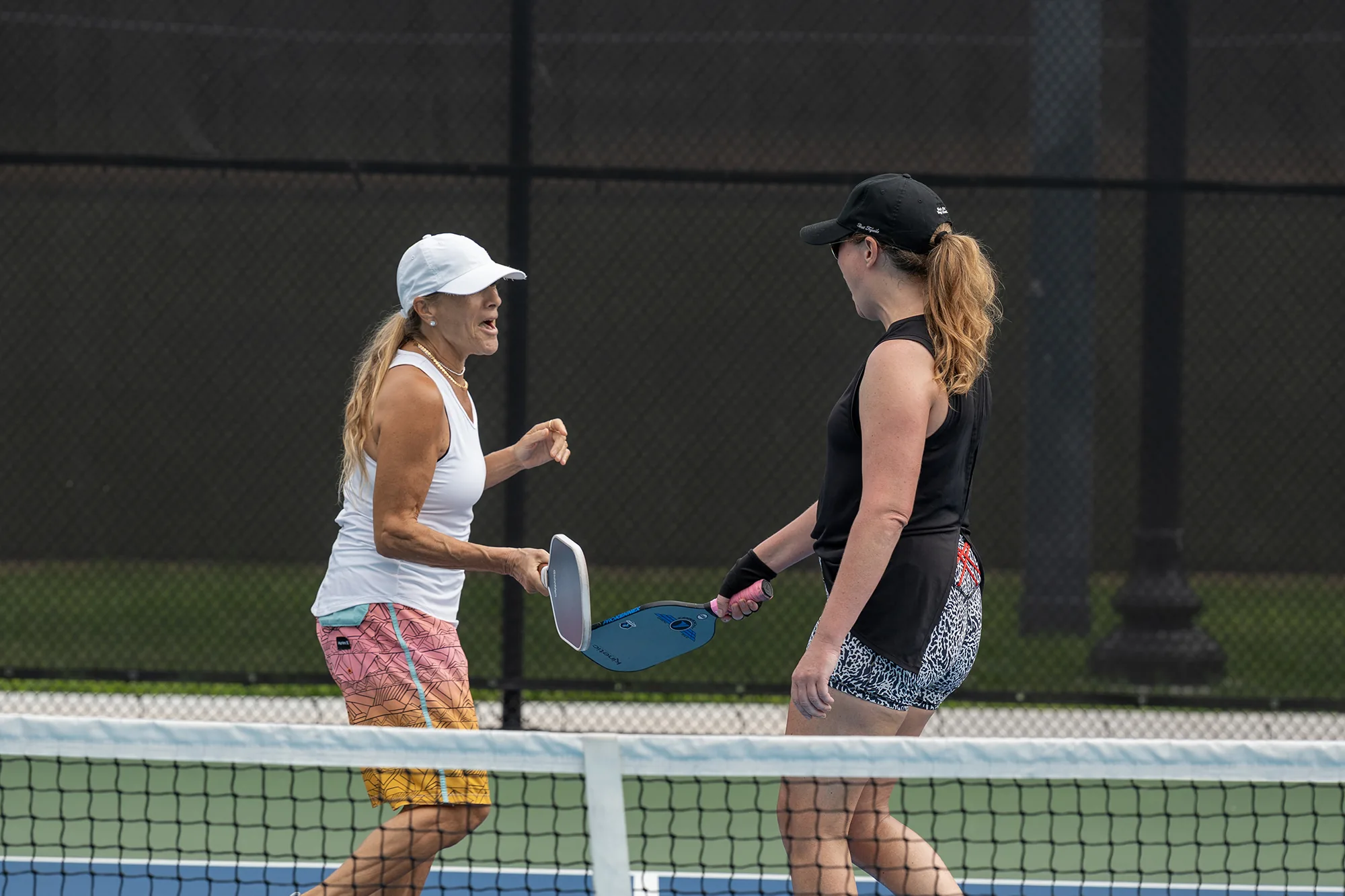 Two people playing pickleball on a Miami Beach court during the 2026 festival