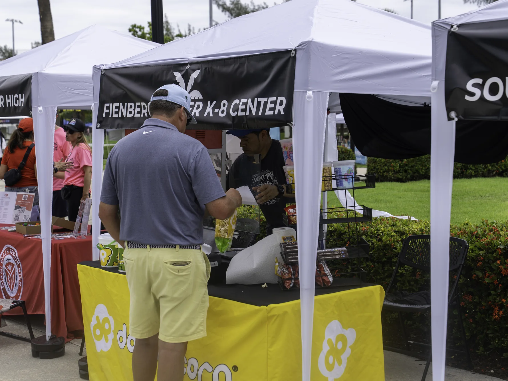 Families visiting local partner tents and vendors at the 2026 festival